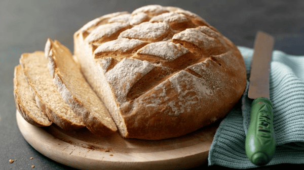 A round loaf of bread sliced