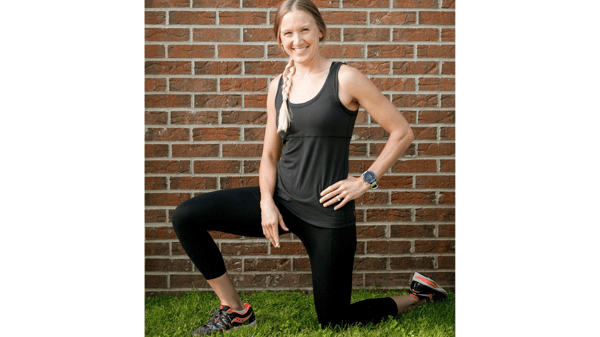 A woman lunging in the grass