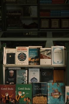 A bookshelf displaying a variety of books in a bookstore setting.