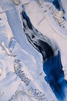 Dynamic abstract artwork with icy tones of blue and white, resembling glacial textures.