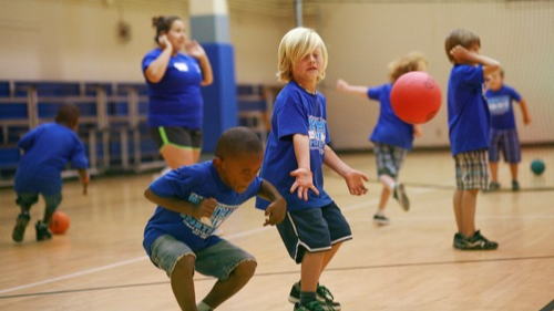 gym of kids playing dodgeball