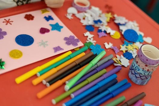 A vibrant assortment of arts and crafts materials on a table, perfect for creativity and decoration projects.