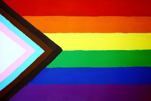 Close-up of the Progress Pride Flag symbolizing LGBTQ+ inclusivity and diversity.