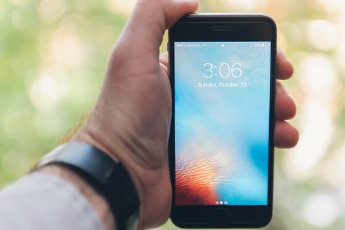 iPhone in Hand - Must Link to https://thoroughlyreviewed.com