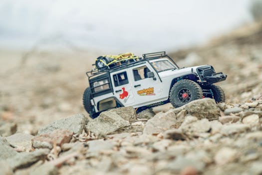 RC off-road vehicle navigating rocky terrain, ideal for adventurous landscapes.