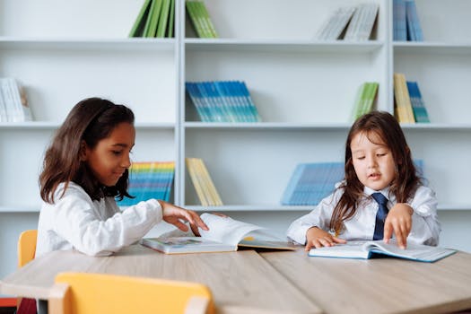 Two young girls enjoying books in a vibrant school library setting.