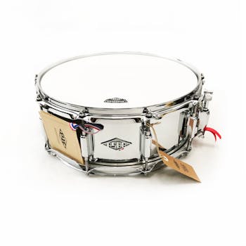 Premium steel snare drum with polished finish, displayed on clean white background. Ideal for musicians.