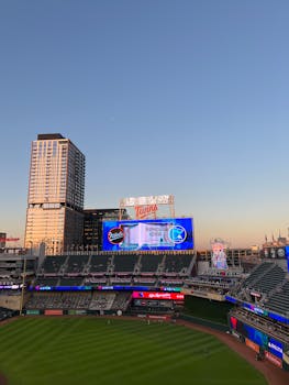Aerial view of Target Field at sunset showcasing the baseball stadium and nearby buildings.